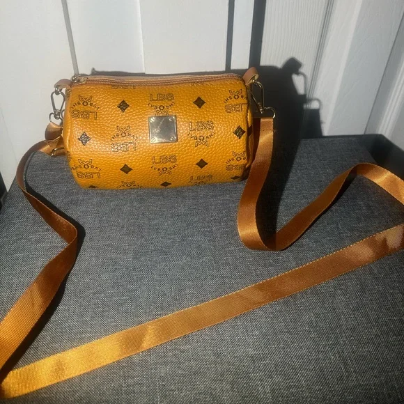 Women's Orange leather mini duffle Crossbody Bag - Picture 1 of 3